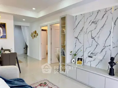 Modern living room with marble accent wall and stylish decor