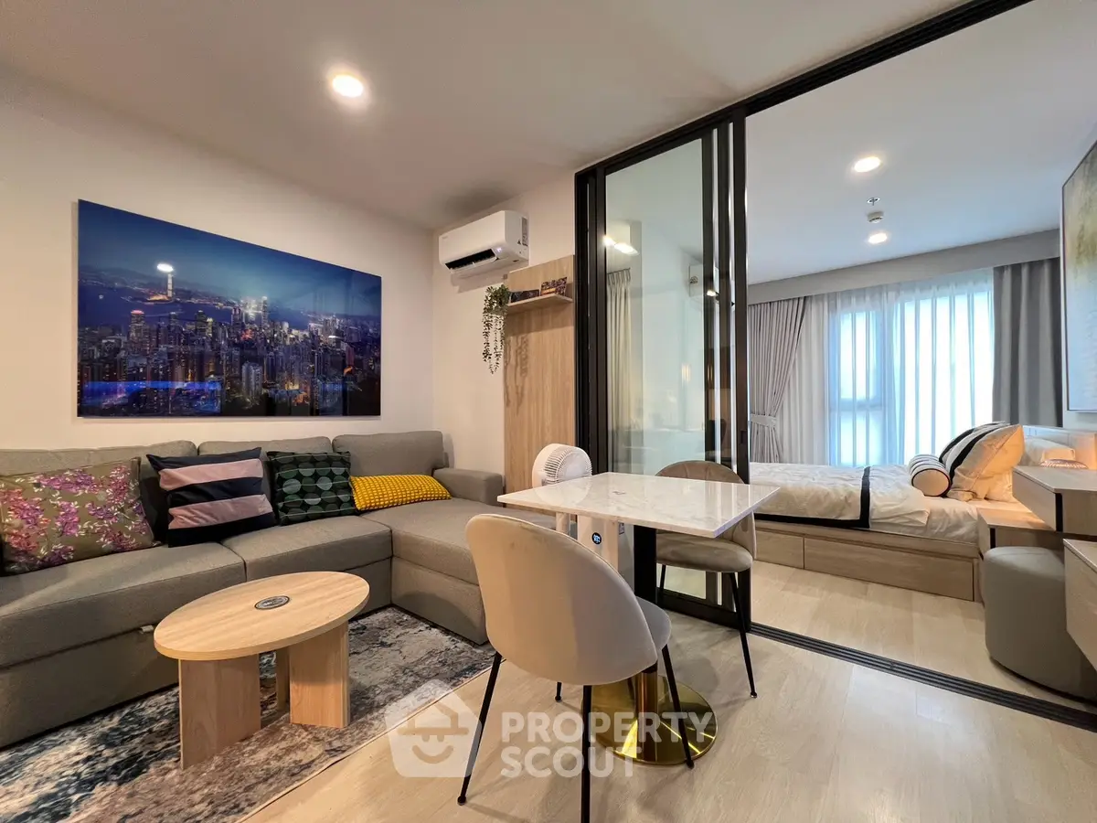 Modern living room with cozy seating and stylish decor in a contemporary apartment.