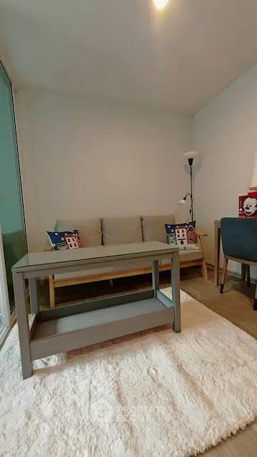 Cozy living room with modern sofa and stylish decor in a bright apartment.