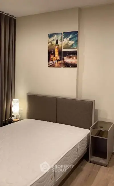 Modern bedroom with stylish decor and comfortable bed in a cozy apartment.