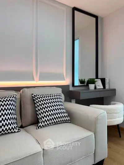 Modern living room with stylish sofa and chic decor, perfect for contemporary urban living.