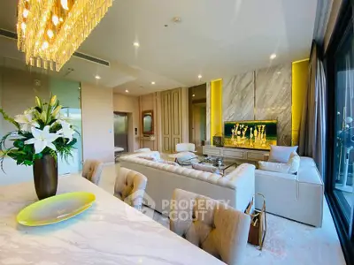 Luxurious living room with elegant decor and modern furnishings in a high-end apartment.