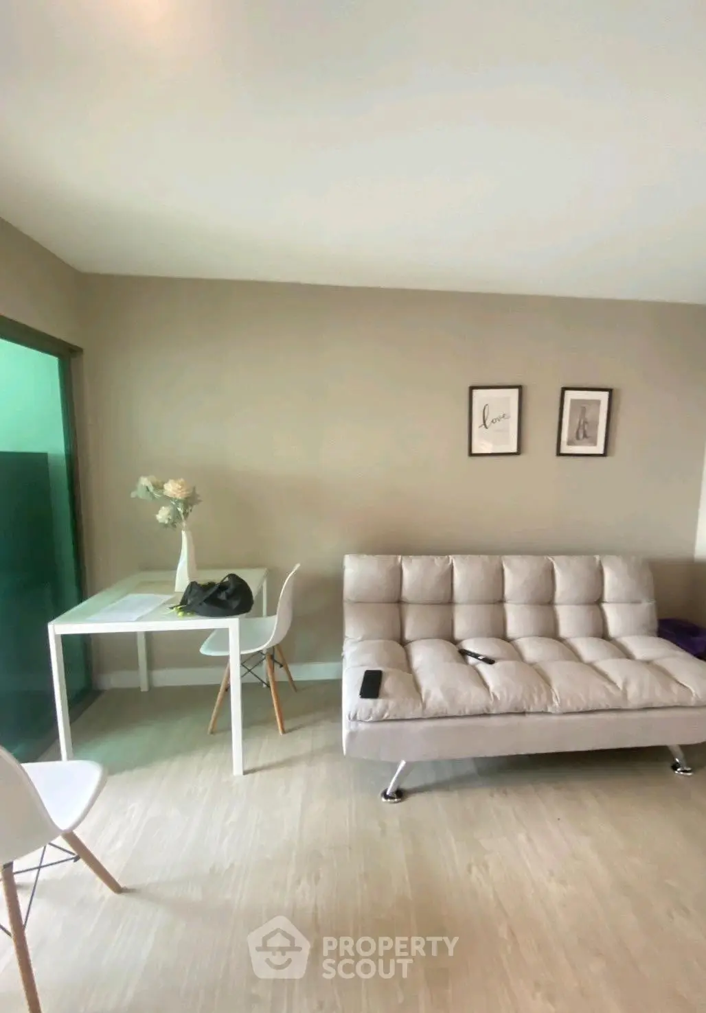 Modern living room with stylish sofa and chic decor, perfect for urban living.