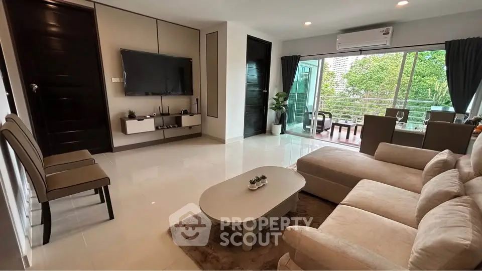 Spacious modern living room with balcony and stylish decor