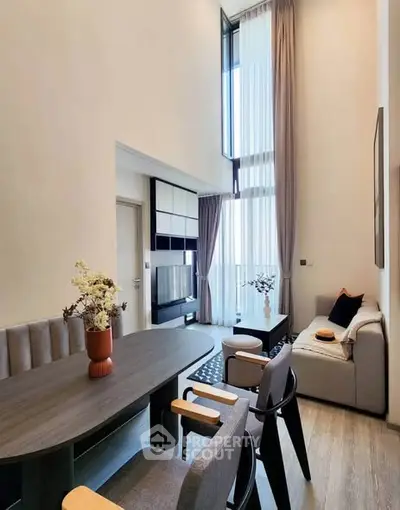 Modern living room with high ceilings and elegant decor