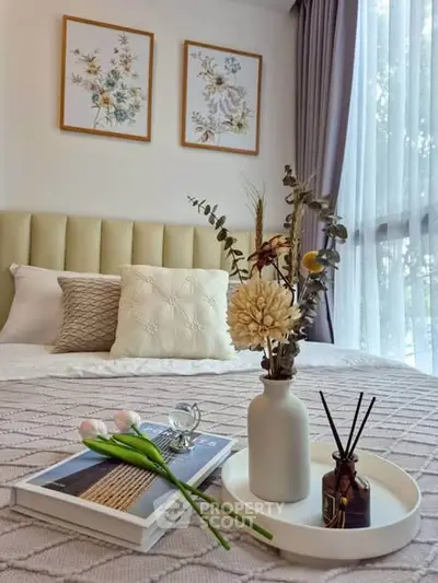 Elegant bedroom with cozy decor and natural light