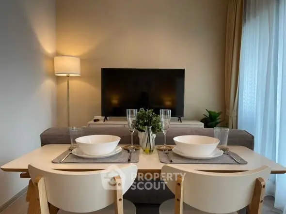 Cozy living room with dining setup and modern decor