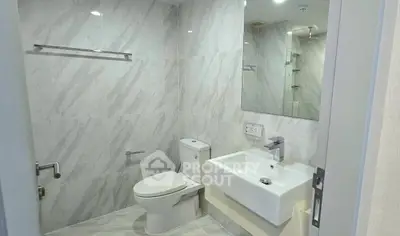 Modern bathroom with sleek fixtures and elegant marble tiles