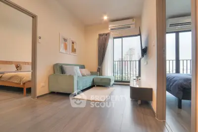 Modern living room with city view, stylish decor, and cozy ambiance.