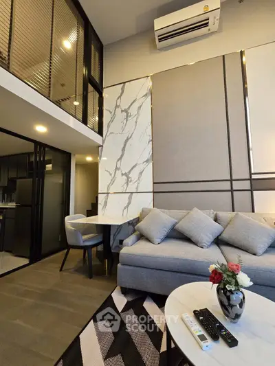 Modern living room with high ceiling and stylish decor in luxury apartment