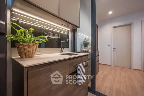 Modern kitchen with sleek cabinets and stylish lighting