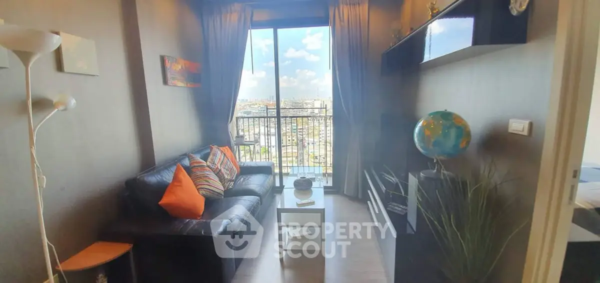 Chic urban living room with balcony view, modern decor, and cozy seating in a high-rise apartment.
