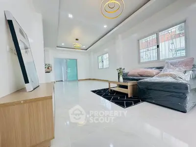 Spacious modern living room with sleek furniture and elegant lighting