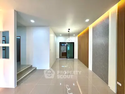 Spacious modern interior with elegant lighting and sleek tile flooring