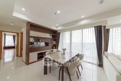 Spacious modern living room with elegant dining area and large windows offering stunning city views.