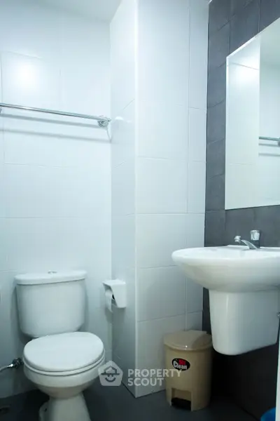 Modern bathroom with sleek white fixtures and minimalist design
