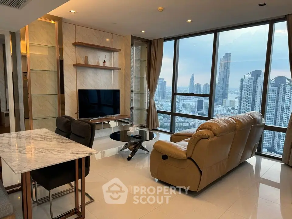 Luxurious high-rise living room with stunning city view and modern furnishings.