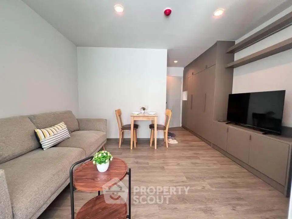 Modern living room with cozy sofa and dining area in stylish apartment