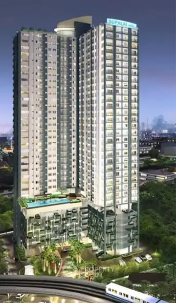 Stunning high-rise building with modern architecture and lush surroundings, perfect for urban living.