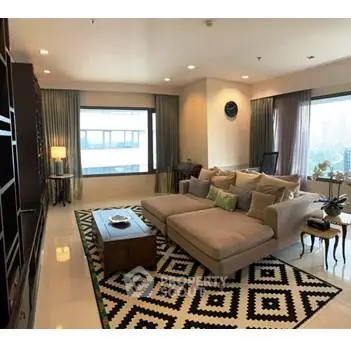 Spacious modern living room with large windows and stylish decor