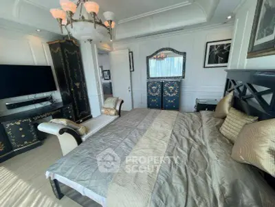 Luxurious bedroom with elegant decor and plush bedding in a high-end real estate property.