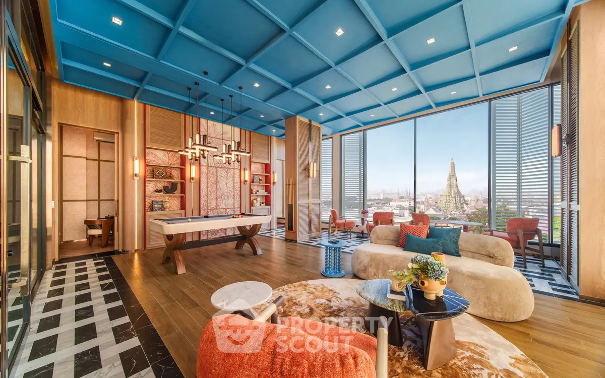 Luxurious living room with stunning city view, modern decor, and vibrant furnishings in a high-rise apartment.