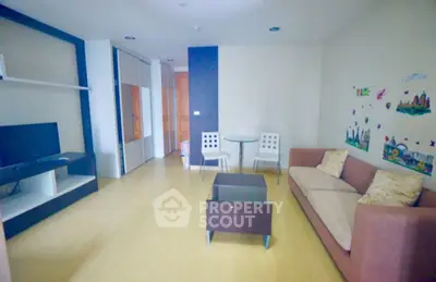 Cozy living room with modern furniture and TV setup