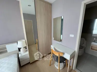 Modern bedroom with stylish furniture and ensuite bathroom, featuring a sleek design and cozy ambiance.