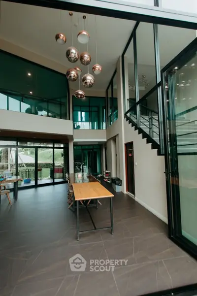 Stunning modern living room with high ceilings and elegant lighting in luxury home