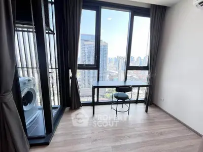 Modern high-rise apartment with stunning city view and sleek interior design.