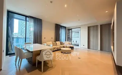 Spacious modern living room with elegant dining area and city view balcony.