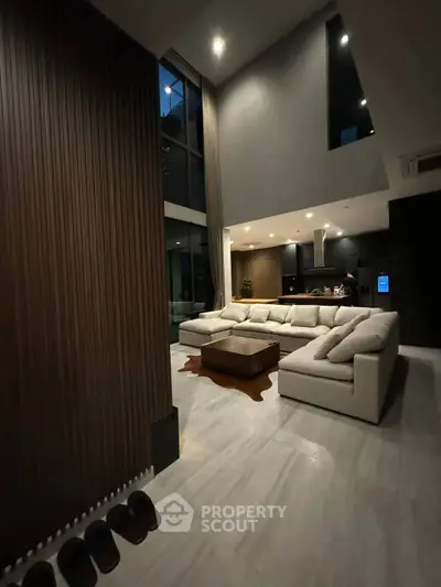 Luxurious modern living room with high ceilings and elegant decor