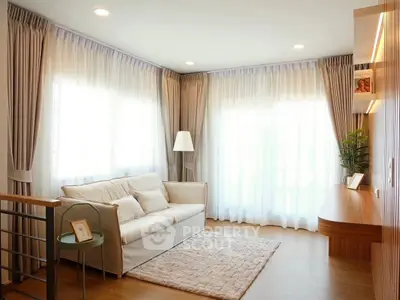 Bright and cozy living room with elegant curtains and modern decor