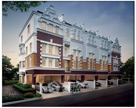 Elegant multi-story residential building with classic architecture and ample parking space.