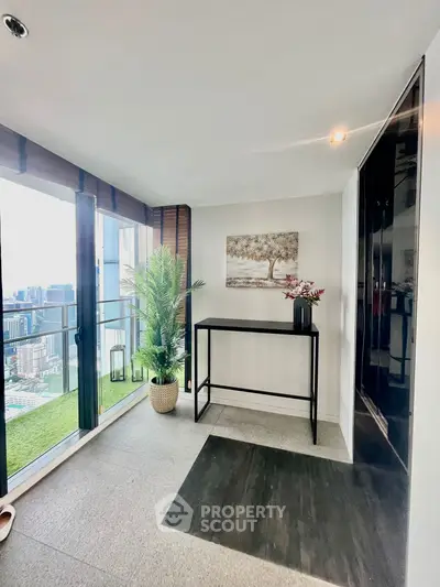 Stylish balcony with city view and modern decor, perfect for relaxation.