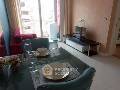 Charming living room with dining area and modern decor in a cozy apartment.