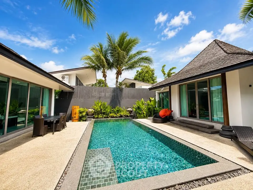 Luxurious tropical villa with private pool and lush garden, perfect for relaxation and entertaining.