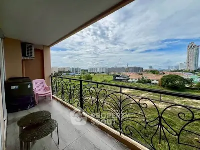 Spacious balcony with stunning cityscape view, perfect for relaxation and enjoying the outdoors.