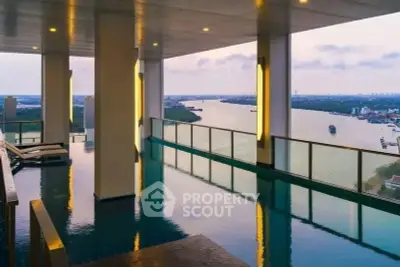 Luxurious rooftop pool with stunning river view in high-rise building