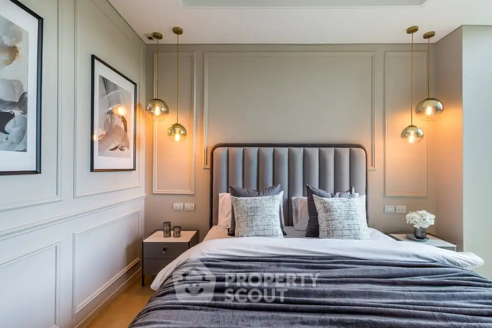 Luxurious modern bedroom with elegant lighting and plush bedding