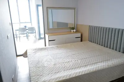 Modern bedroom with stylish headboard and natural light