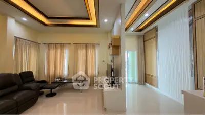 Spacious modern living room with elegant lighting and stylish decor