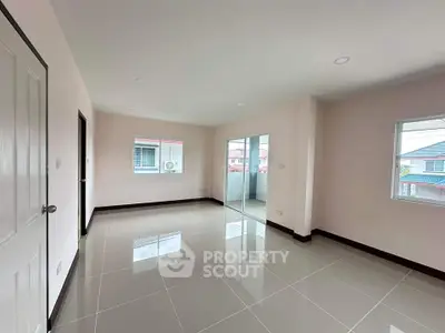 Spacious empty room with large windows and glossy tiled floor, perfect for customization.