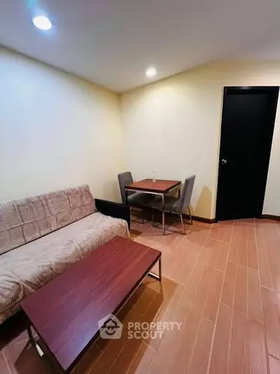 Cozy living room with modern furniture and warm lighting, perfect for relaxation and entertaining.