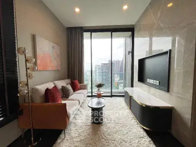 Luxurious living room with modern decor and stunning city view from large windows.