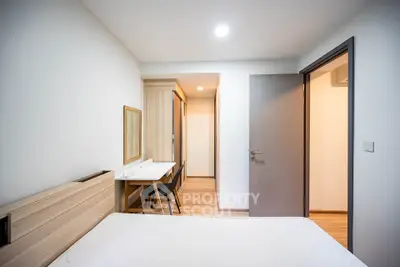 Modern bedroom with wooden furniture and minimalist design
