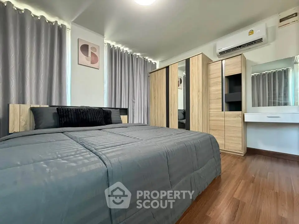 Modern bedroom with stylish decor and ample storage space