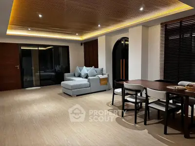 Spacious modern living room with elegant lighting and stylish furniture