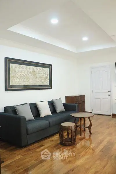 Elegant living room with wooden flooring and stylish furniture
