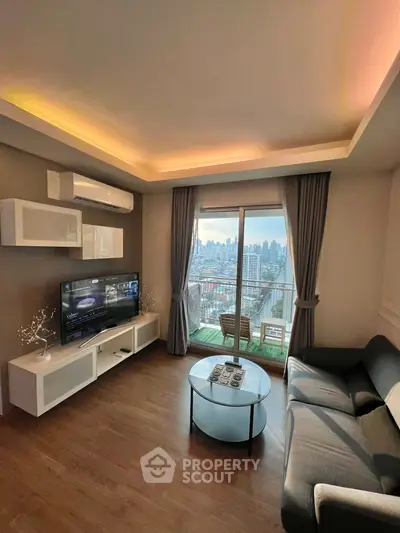 Modern living room with city view, stylish furniture, and ambient lighting in a high-rise apartment.